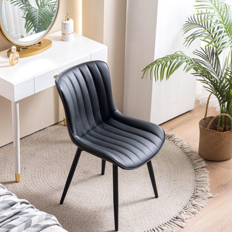 Black leather chair with silver online legs